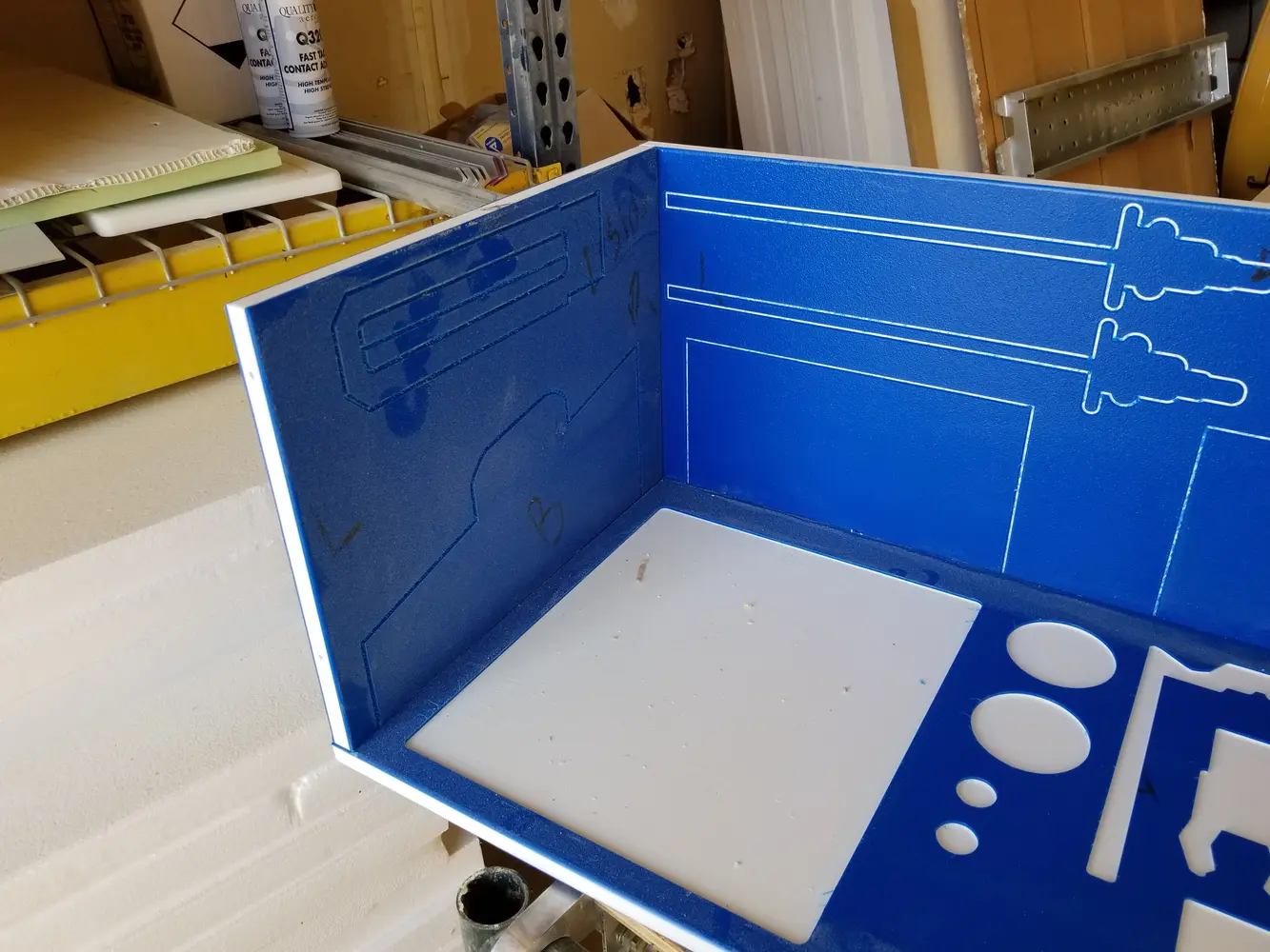 Custom blue industrial shadow board with routed tool locations